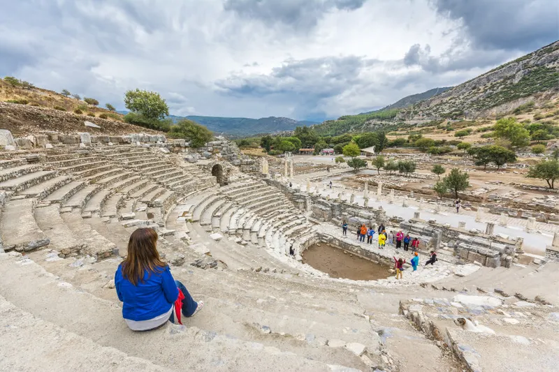 Traveller overlooking the ancient theatre at Ephesus